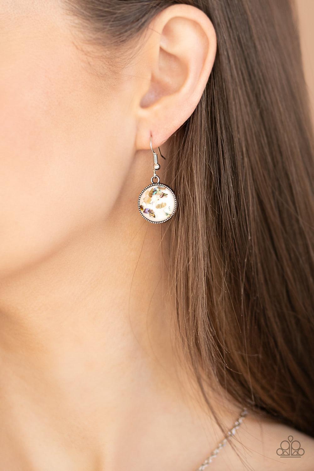 Paparazzi Accessories Confetti and Cocktails - White Featuring flecks of iridescent shell-like accents, four glassy white beads stack into a dazzling pendant at the bottom of a shimmery silver chain for an effervescent look. Features an adjustable clasp c