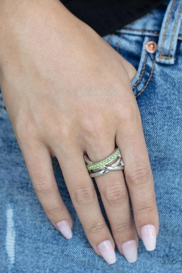 Paparazzi Accessories Forever Flawless - Green Bands of crisscrossing shining silver bars are highlighted by a row of glittering Peridot rhinestones for a ritzy finish across the finger. Features a stretchy band for a flexible fit. Rings