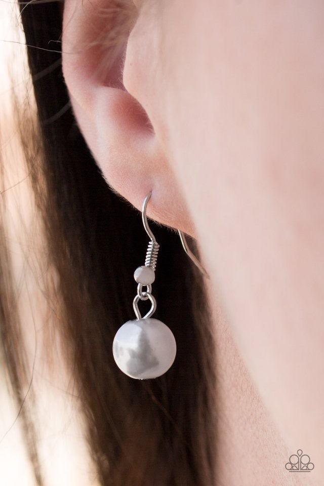 Paparazzi Accessories Hoppin Hearts - Silver Three rows of mismatched silver chains layer below the collar. Infused with airy heart cut-out centers, delicately hammered silver discs and pearly silver beads swing from the bottom of the lowermost chain, cre