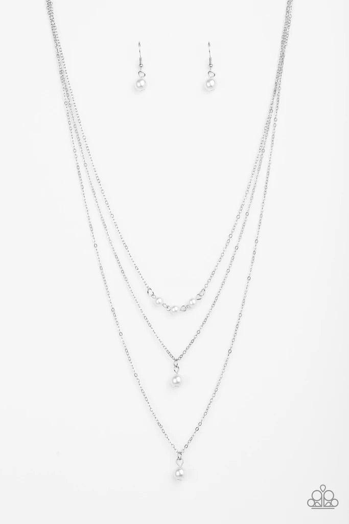 Paparazzi Accessories High Heels and Hustle - White A trio of pearly white beads give way to layers of solitaire white pearl pendants below the collar for a refined flair. Features an adjustable clasp closure. Sold as one individual necklace. Includes one