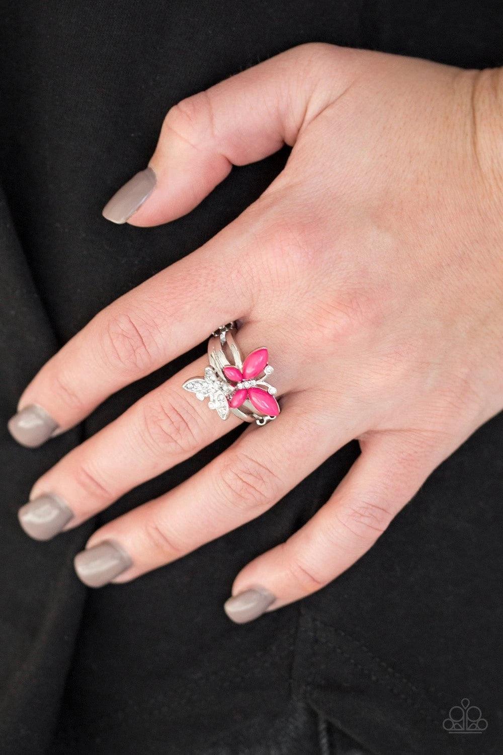 Paparazzi Accessories Flutter Flirt ~Pink Infused with dainty white rhinestones, a pink beaded butterfly joins a white rhinestone encrusted butterfly atop stacked silver bands for a whimsical fashion. Features a dainty stretchy band for a flexible fit. So