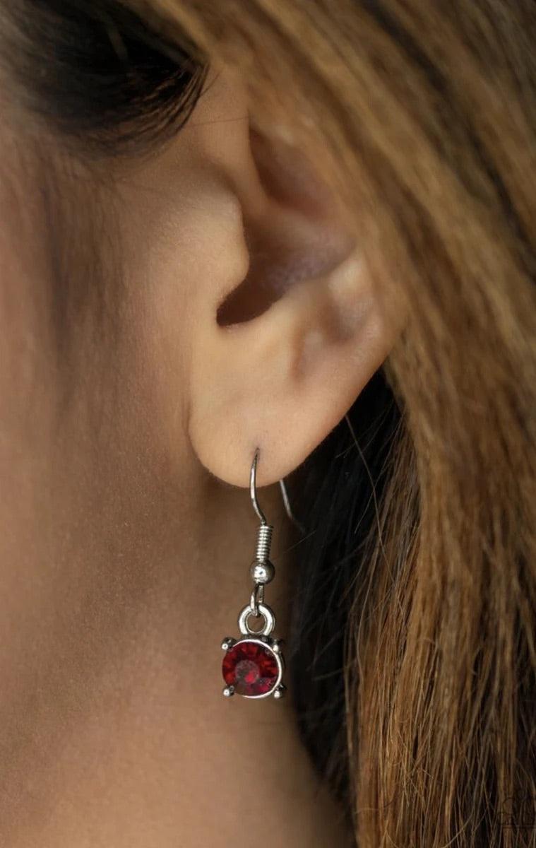 Paparazzi Accessories Metro Mixer - Red Dotted with glassy red rhinestones and glistening silver accents, a collision of mismatched silver chains layer down the chest for a refined flair. Features an adjustable clasp closure. Sold as one individual neckla