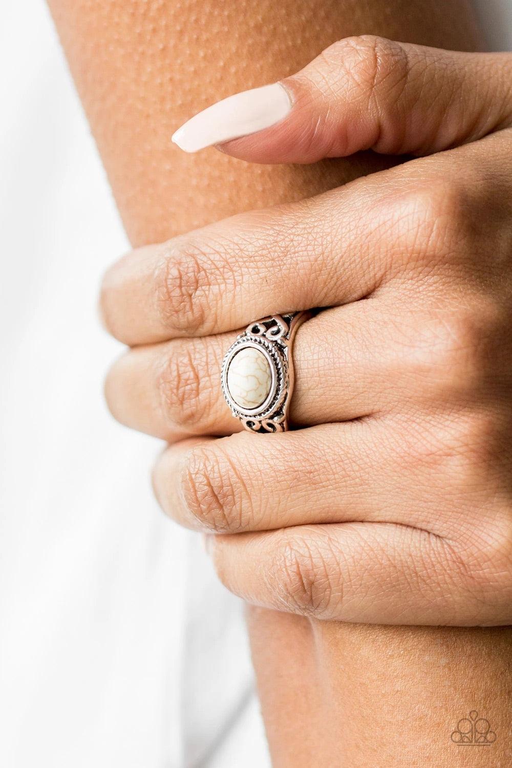 Paparazzi Accessories Set In Stone - White A refreshing white stone is pressed into the center of a dainty silver band radiating with studded and filigree textures for a seasonal look. Features a dainty stretchy band for a flexible fit. Sold as one indivi
