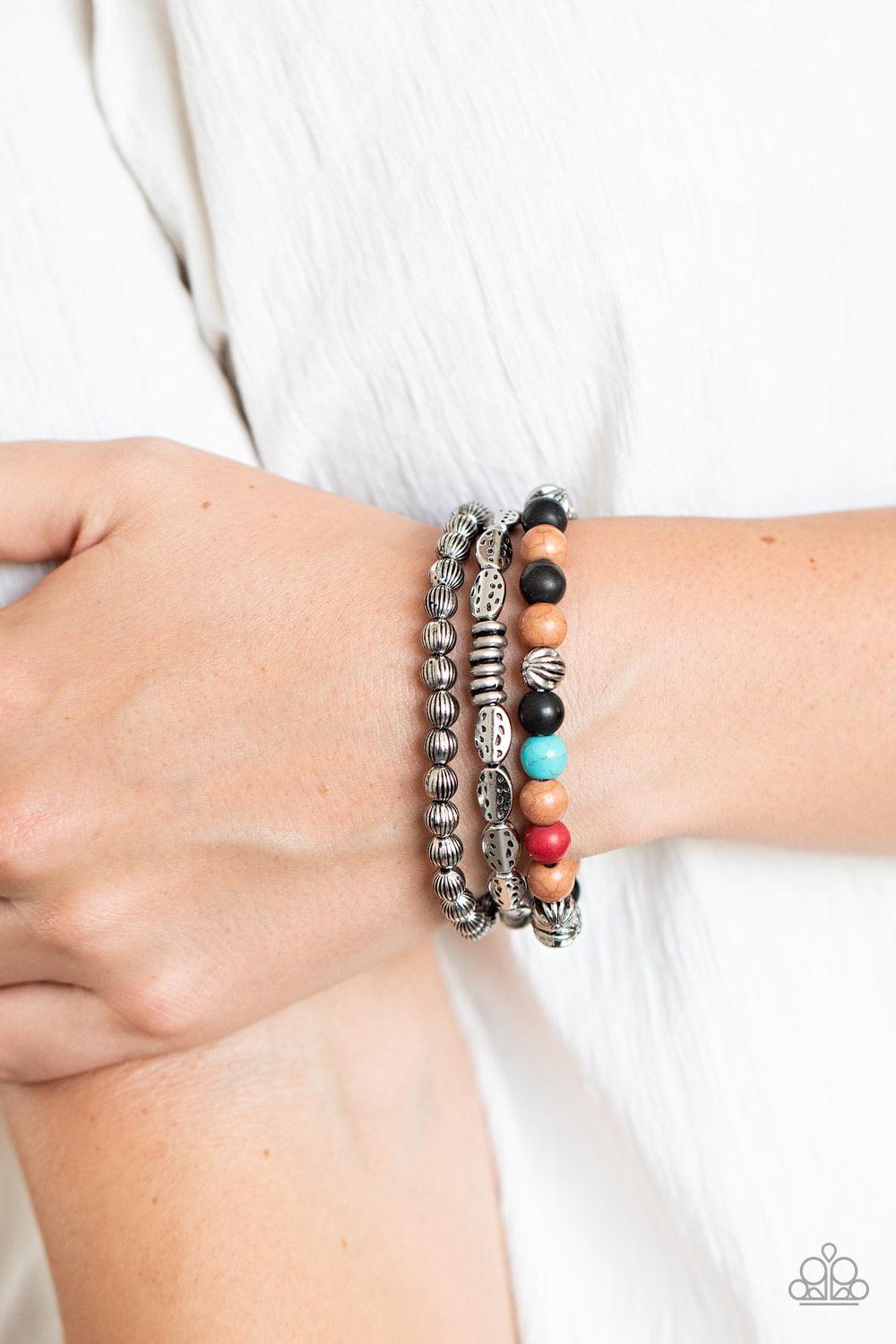Paparazzi Accessories Trail Mix Mecca - Multi An earthy collision of multicolored stones, ornate silver beads and hammered silver accents are threaded along stretchy bands around the wrist, creating colorful layers. Sold as one set of three bracelets. Jew