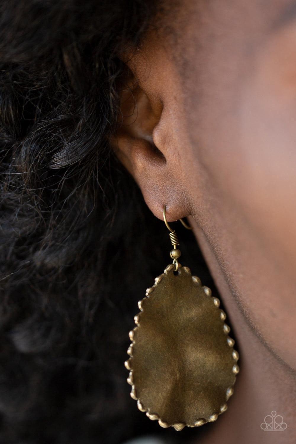 Paparazzi Accessories Trail Ware - Brass Brushed in a burnished finish, a hammered brass teardrop swings from the ear. The antiqued frame features textured edging for a rugged finish. Earring attaches to a standard fishhook fitting. Jewelry