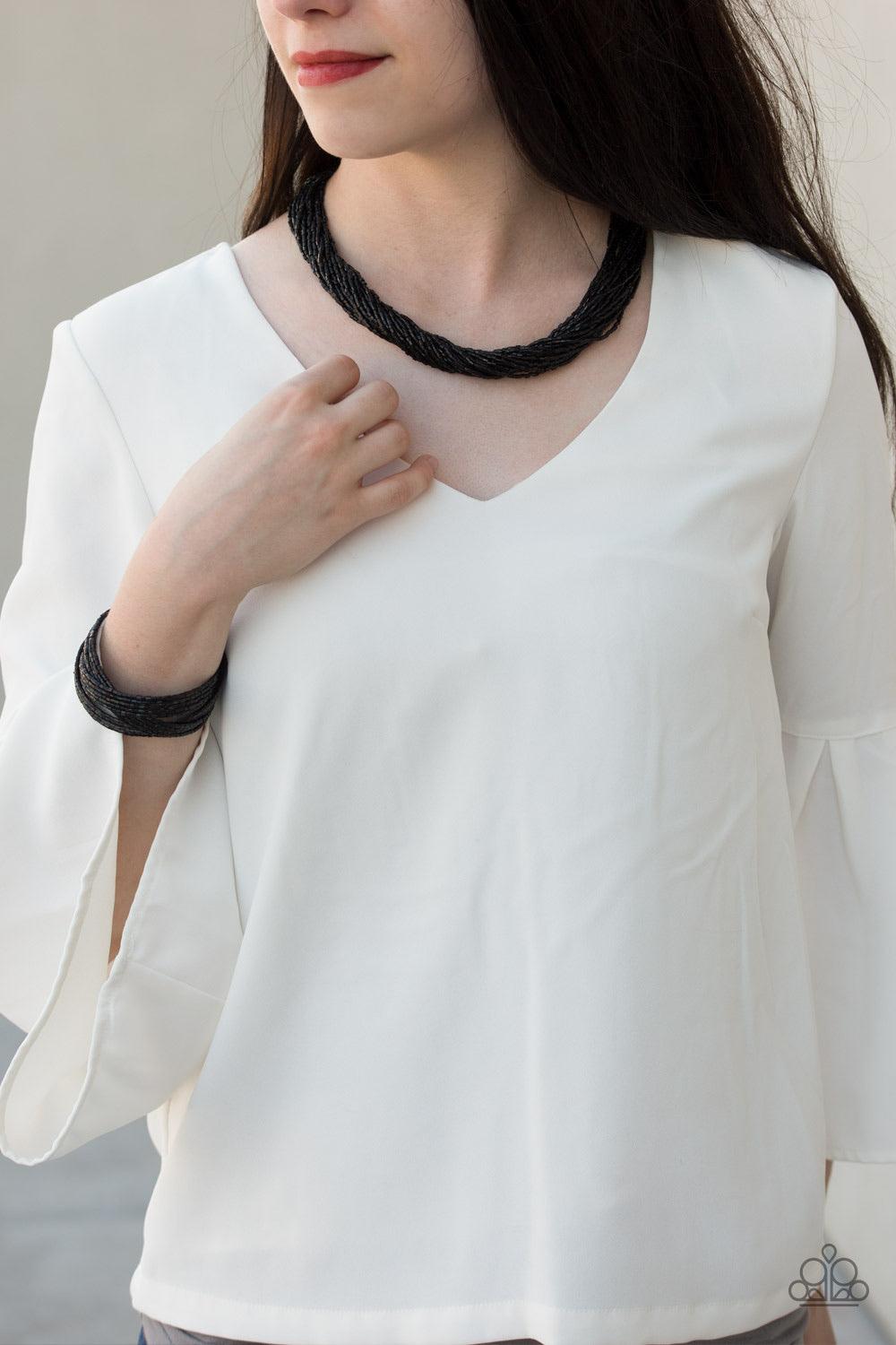Paparazzi Accessories The Speed of STARLIGHT ~Black Strands of shiny black seed beads subtlety twist below the collar, coalescing into a blinding shimmer. Features an adjustable clasp closure.