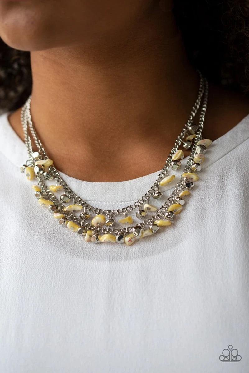 Paparazzi Accessories Pebble Pioneer - Yellow Two strands of iridescent yellow pebbles and faceted silver beads swing from the bottoms of two layered chains, creating a colorful fringe below the collar. Features an adjustable clasp closure. Sold as one in