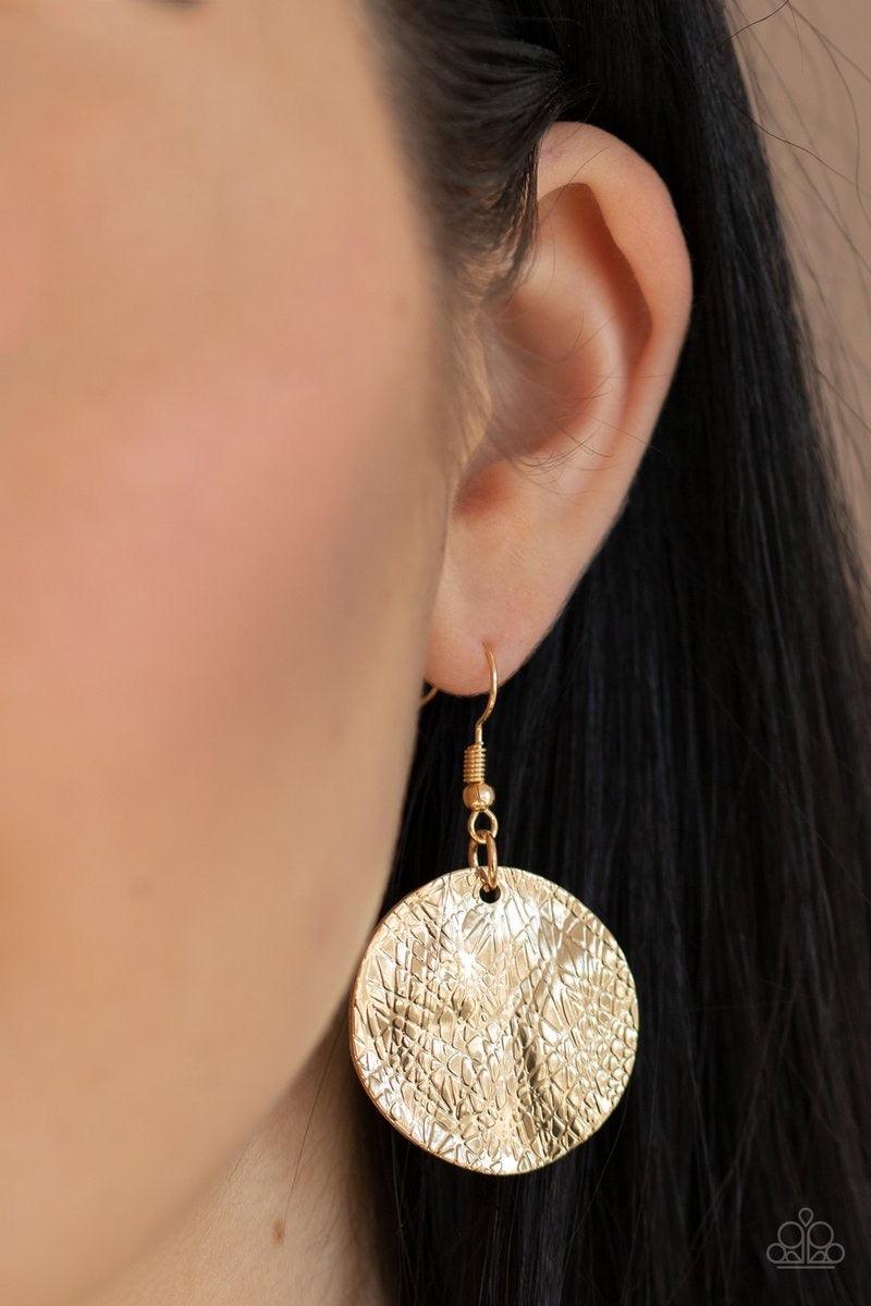 Paparazzi Accessories Barely Scratched The Surface - Gold Scratched in shimmer, warped gold discs swing from the bottom of a thick gold chain, creating a bold fringe below the collar. Features an adjustable clasp closure. Sold as one individual necklace.