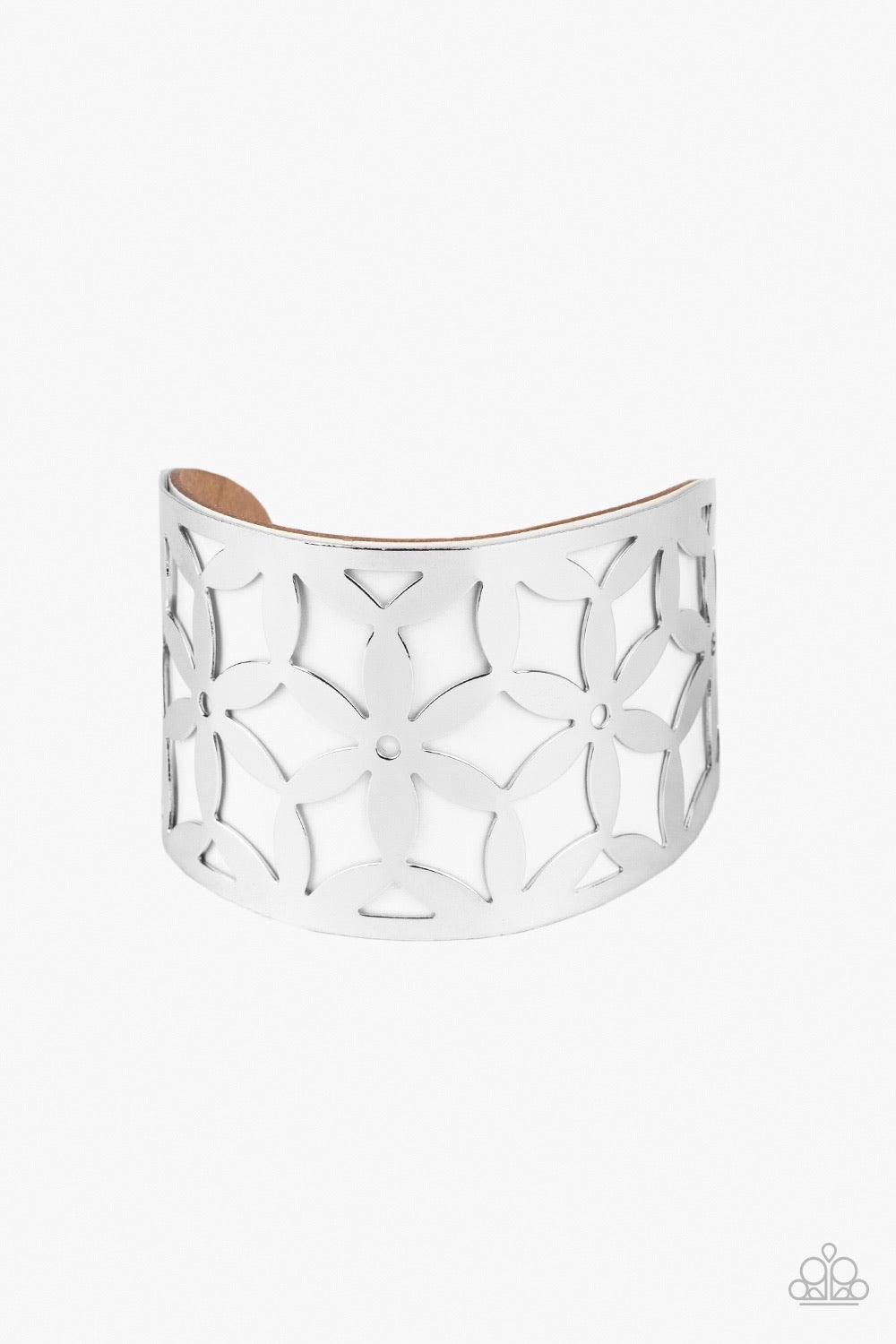 Paparazzi Accessories Garden Fiesta - White A thick piece of white leather peeks out through a daisy stenciled silver cuff, creating a colorful centerpiece around the wrist. Sold as one individual bracelet. Jewelry