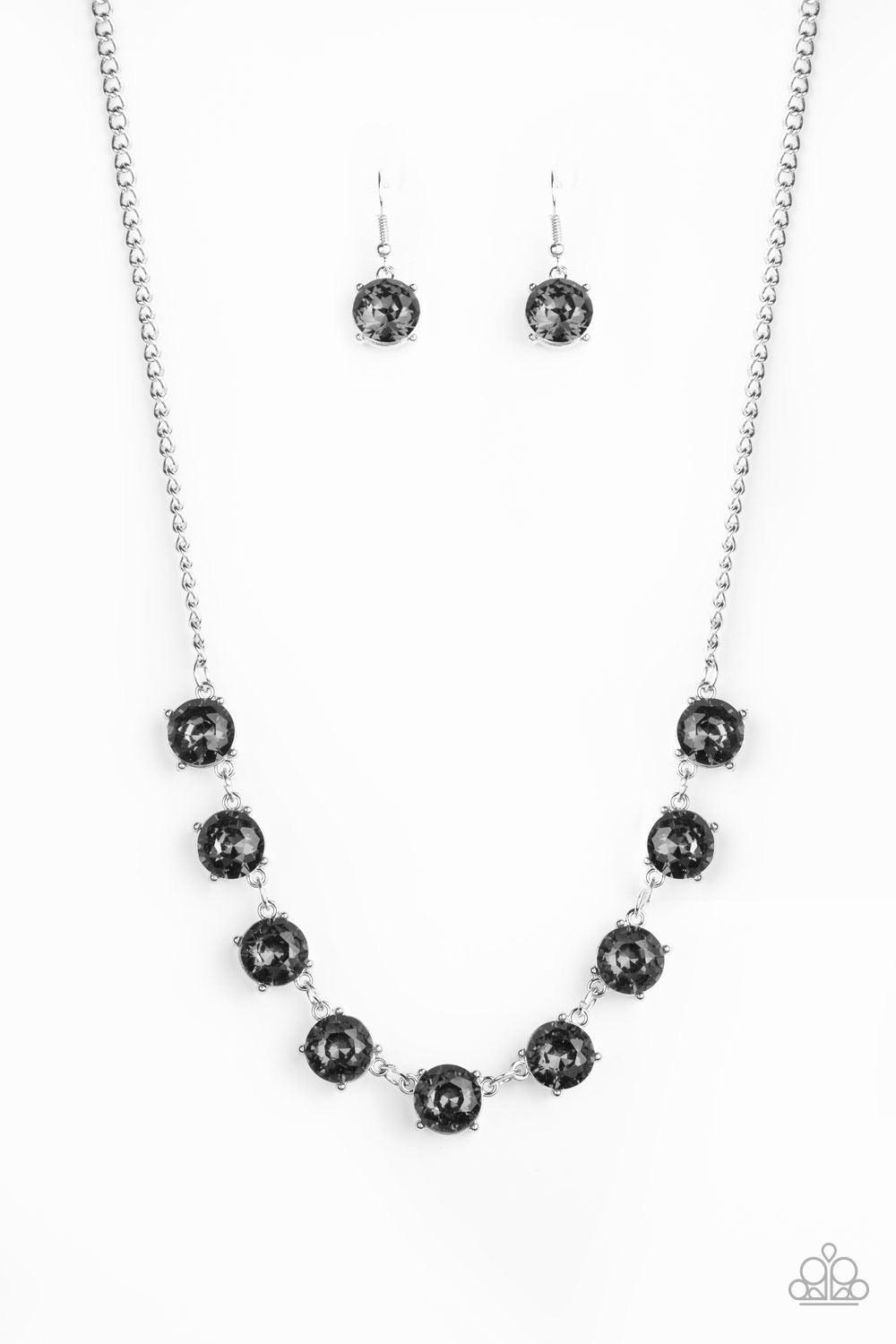 Paparazzi Accessories Iridescent Icing - Silver Featuring sleek silver fittings, a collection of oversized smoky rhinestones link below the collar for an icy look. Features an adjustable clasp closure. Jewelry