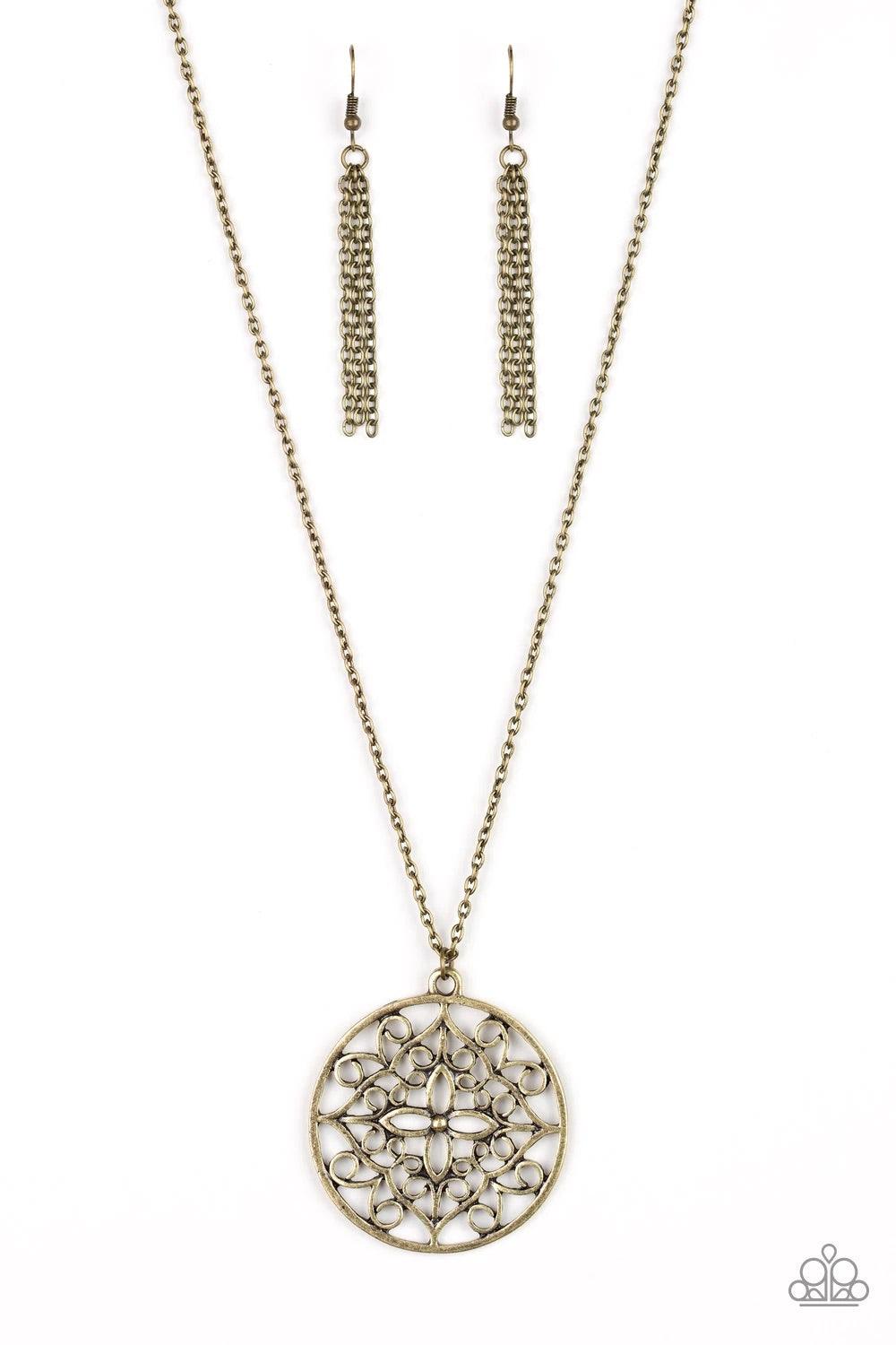 Paparazzi Accessories Mandala Melody - Brass Featuring a whimsical mandala pattern, a glistening brass pendant swings from the bottom of a lengthened brass chain for a seasonal look. Features an adjustable clasp closure. Sold as one individual necklace. I