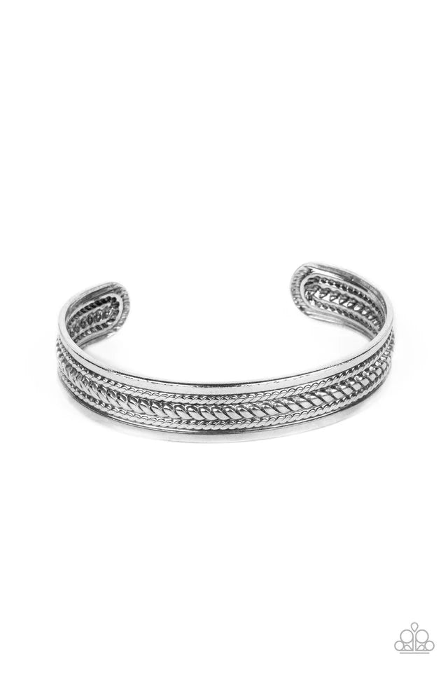 Paparazzi Accessories Urban Expedition - Silver The center of a rustic silver cuff is embossed in metallic rope-like texture, creating a tribal inspired centerpiece around the wrist. Jewelry