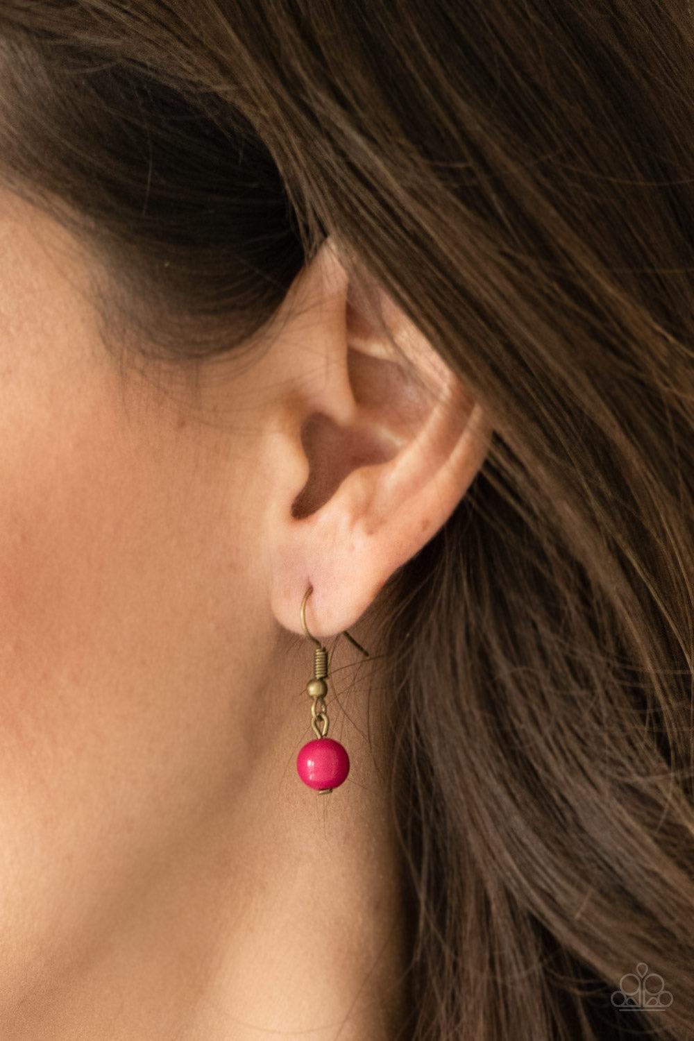 Paparazzi Accessories The GRIT Crowd - Pink Pearly brass, polished pink, and glittery crystal-like beads swing from a bold brass chain, creating a refined fringe below the collar. Features an adjustable clasp closure. Jewelry