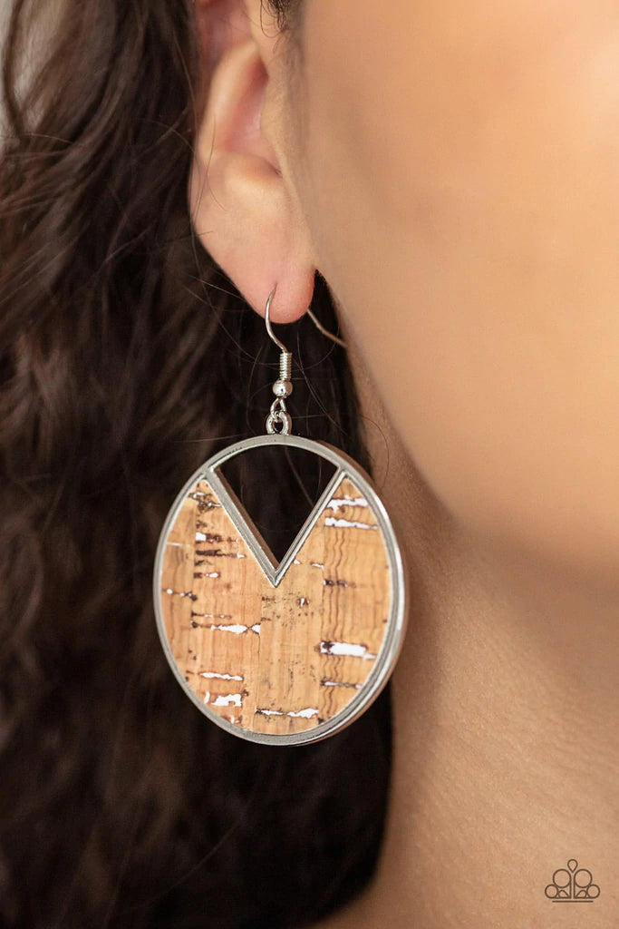 Paparazzi Accessories Nod To Nature - White Featuring hints of white accents, an earthy piece of cork is placed into the center of a circular hoop. A triangular slice is removed from the cork, creating an edgy airy finish. Earring attaches to a standard f