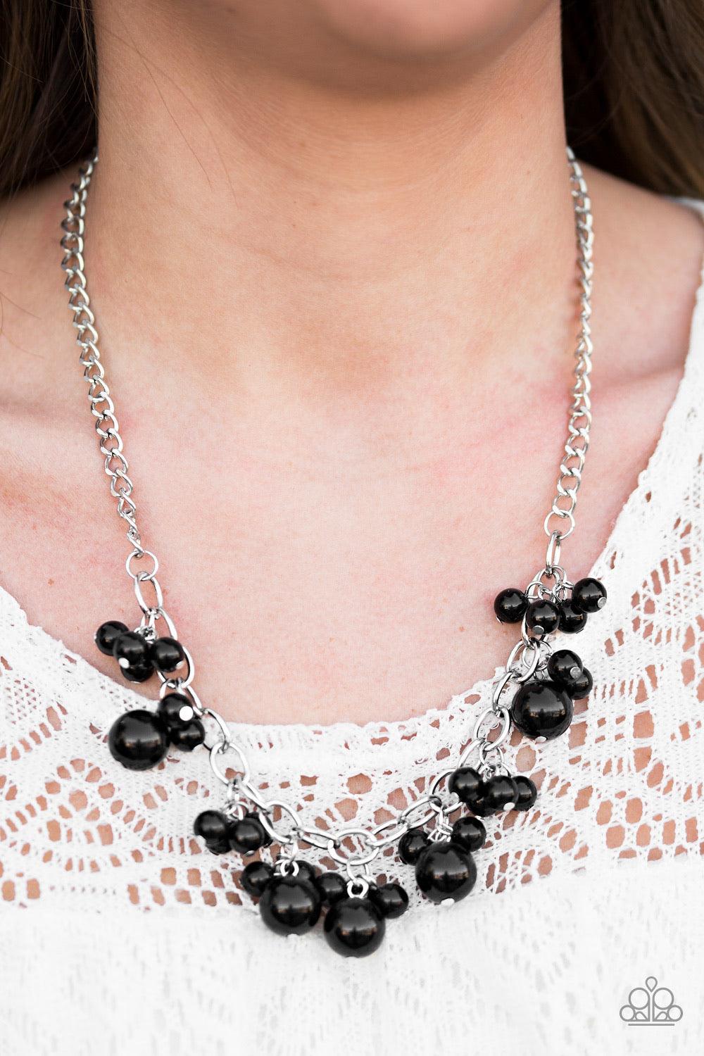 Paparazzi Accessories Celebrity Treatment - Black Clusters of large and small black beads cascade from the bottom of a bold silver chain, creating a refined fringe below the collar. Features an adjustable clasp closure. Sold as one individual necklace. In