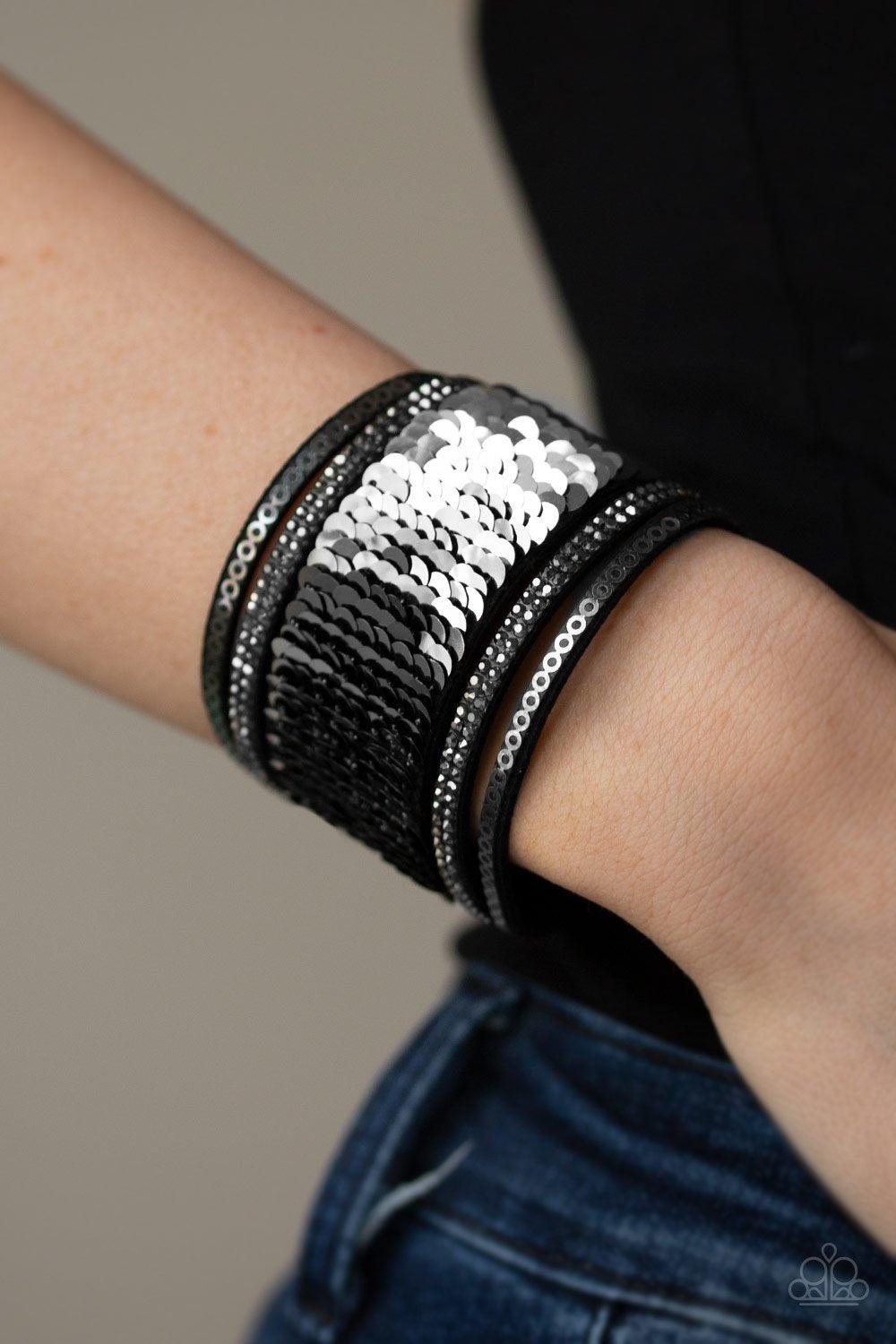 Paparazzi Accessories Heads or MERMAID Tails - Black Infused with strands of smoky hematite rhinestones and dainty metallic accents, row after row of shimmery sequins are stitched across the front of a spliced black suede band. Bracelet features reversibl