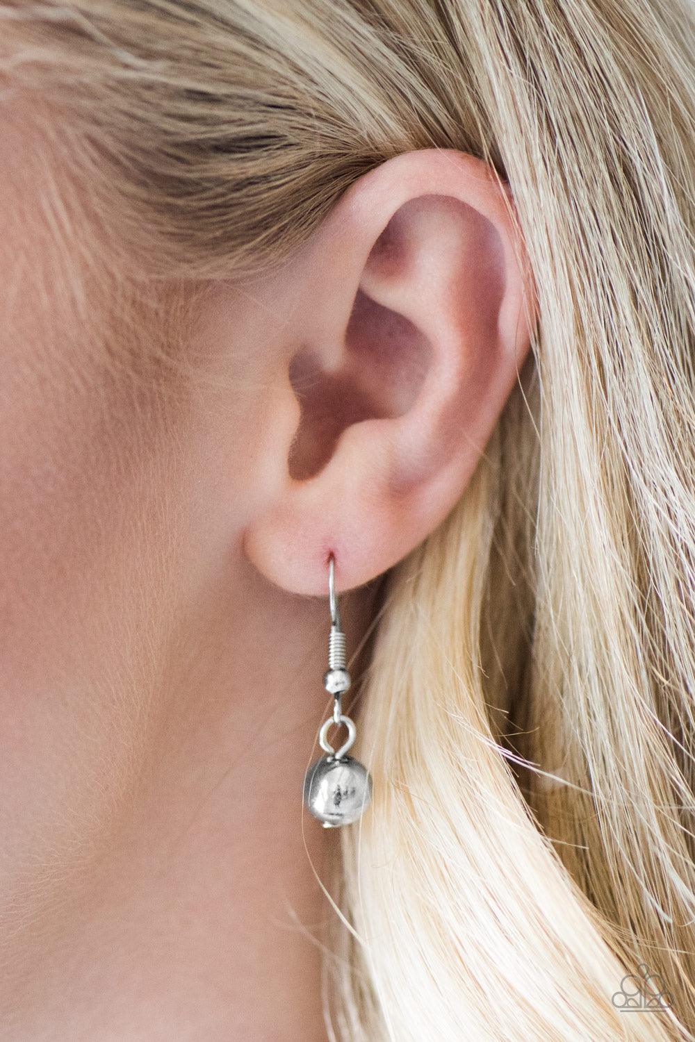 Paparazzi Accessories Belle of the Ball - Silver Varying in size and shimmer, classic and faceted silver beads trickle from the bottom of a shimmery silver chain, creating a bold fringe below the collar. Features an adjustable clasp closure. Sold as one i