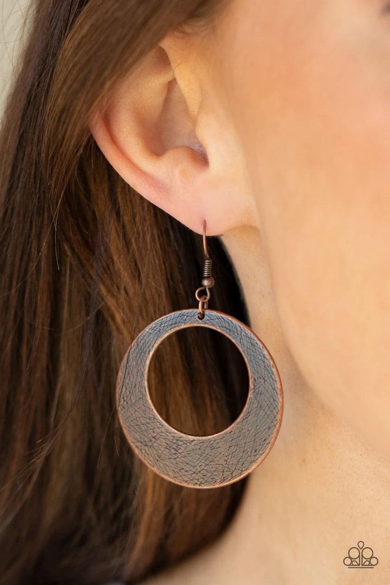 Paparazzi Accessories Outer Plains - Copper Brushed in an antiqued shimmer, a round copper frame is scratched in a gritty linear pattern for a rustic fashion. Earring attaches to a standard fishhook fitting. Sold as one pair of earrings. Jewelry