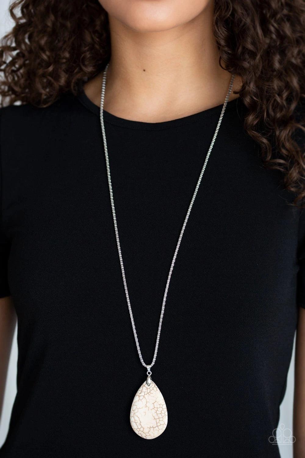 Paparazzi Accessories Sedona Sandstone - White Pinched between a dainty silver fitting, an oversized white stone teardrop pendant swings from the bottom of a lengthened silver popcorn chain for a seasonal flair. Features an adjustable clasp closure.Sold a