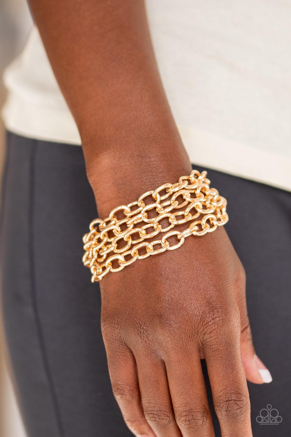 Paparazzi Accessories Fast Ball - Gold Four strands of bold gold chain layer across the wrist for an edgy look. Features an adjustable clasp closure. Jewelry