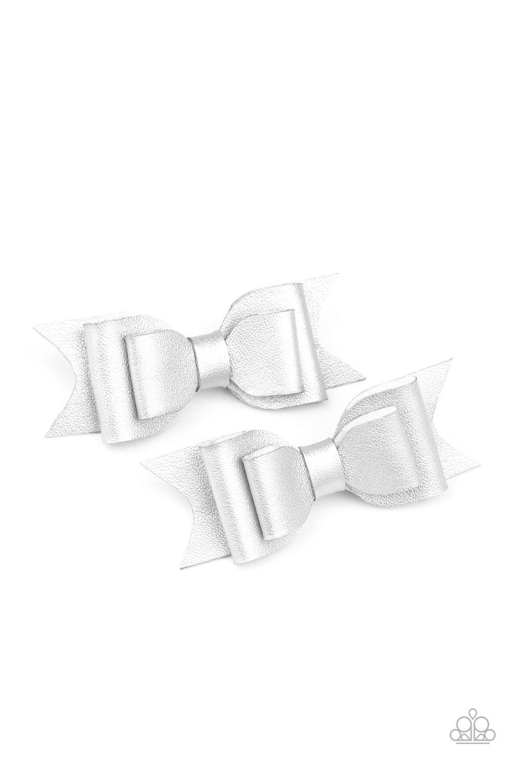 Paparazzi Accessories Totally BOWS my Mind! - White Painted in a shimmery silver sheen, two leather ribbons fold into a pair of dainty bows, creating a charming duo. Features a standard hair clip on the back. Hair Accessories
