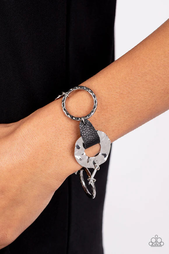Paparazzi Accessories Desert Scraps - Black Desert Scraps is a bracelet made of gold and silver discs hammered in a handcrafted texture. This piece represents the beauty in things that cannot be seen with the naked eye, such as the intricate patterns foun