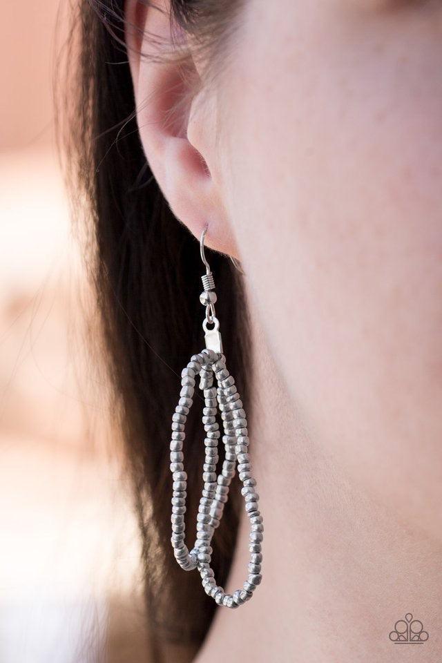 Paparazzi Accessories Mesmerizingly Mesopotamia - Silver Brushed in a flashy shimmer, metallic seed beads braid into an indigenous braid below the collar for a seasonal look. Features an adjustable clasp closure. Sold as one individual necklace. Includes