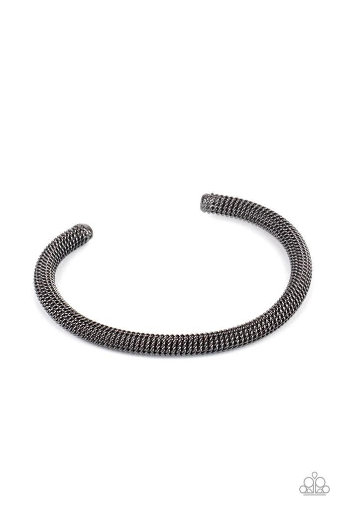 Paparazzi Accessories Metro Machiavellian - Black A dainty row of glistening gunmetal chain twists around a gunmetal cuff, creating an edgy industrial display around the wrist. Sold as one individual bracelet. Jewelry