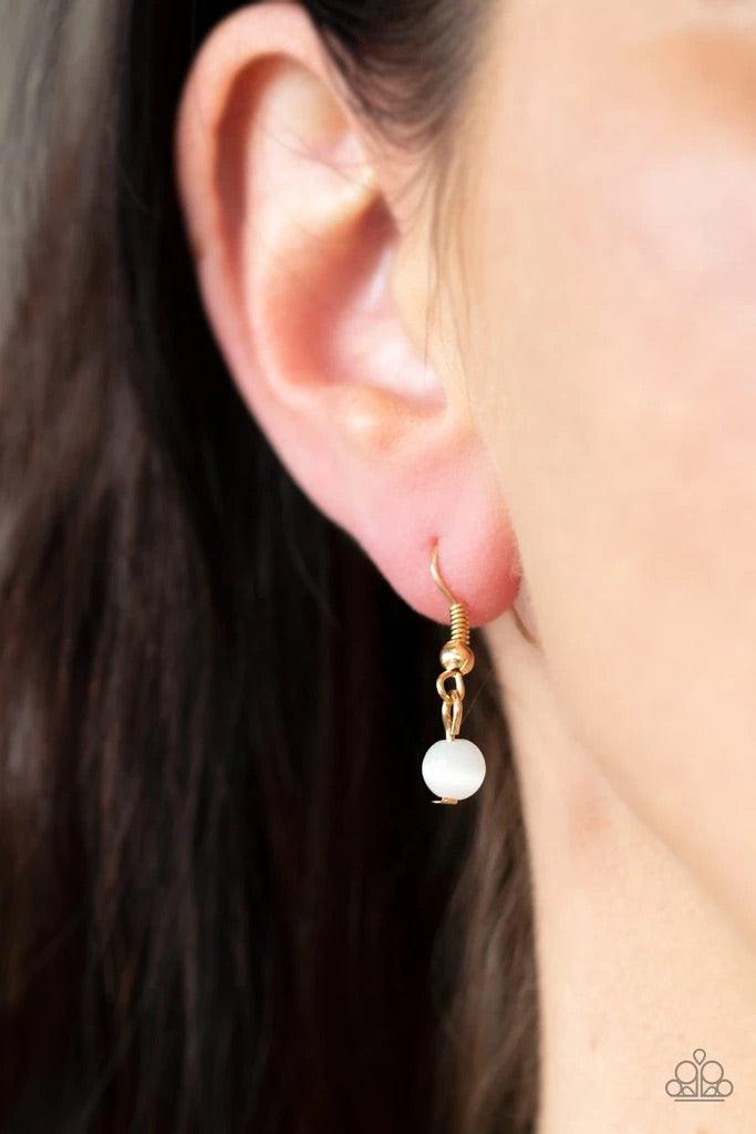 Paparazzi Accessories Hook, Vine, and Sinker - Gold Dotted with glowing cat's eye accents, two dizzying gold frames swing at the bottom of a lengthened gold chain. The stacked pendants swirl with studded patterns and vine-like filigree for a seasonal flai