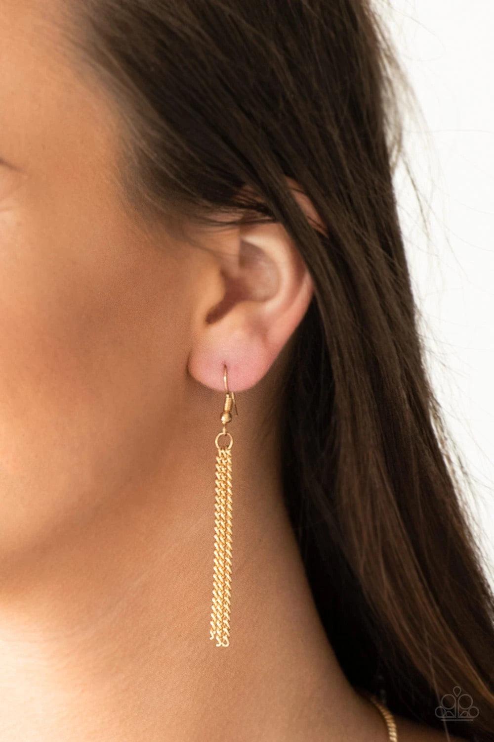 Paparazzi Accessories The Pack Leader - Gold Infused with shiny black beading, glistening gold triangular frames join below the collar, creating a fierce geometric fringe. Features an adjustable clasp closure. Sold as one individual necklace. Includes one