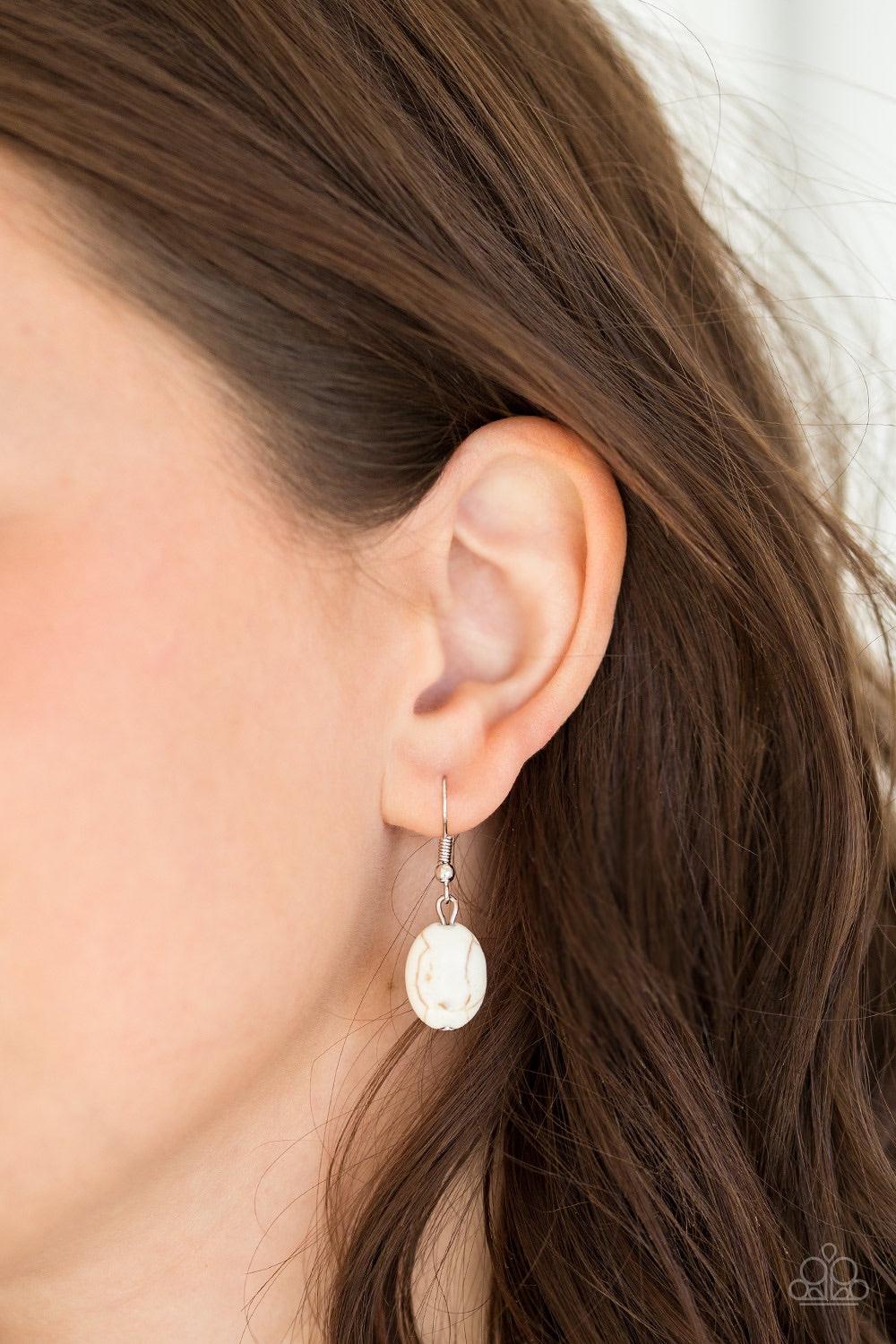 Paparazzi Accessories Southwest Showdown - White A smooth white stone is pressed into a textured silver frame, creating a bold seasonal pendant below the collar. Features an adjustable clasp closure Jewelry