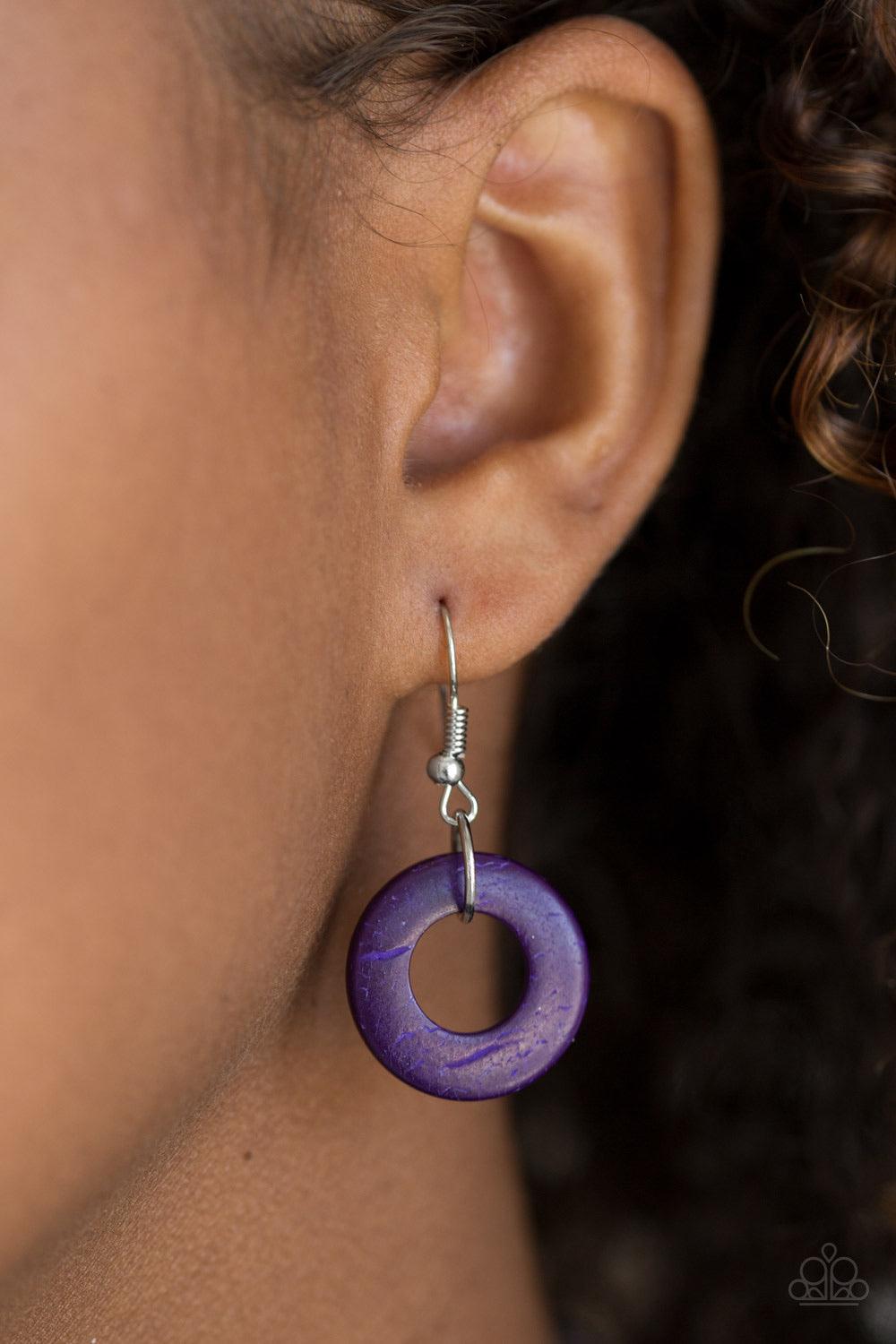 Paparazzi Accessories Waikiki Winds ~Purple Shiny brown cording knots around vivacious purple wooden discs, creating a colorful display across the chest. Features a button loop closure. Sold as one individual necklace. Includes one pair of matching earrin