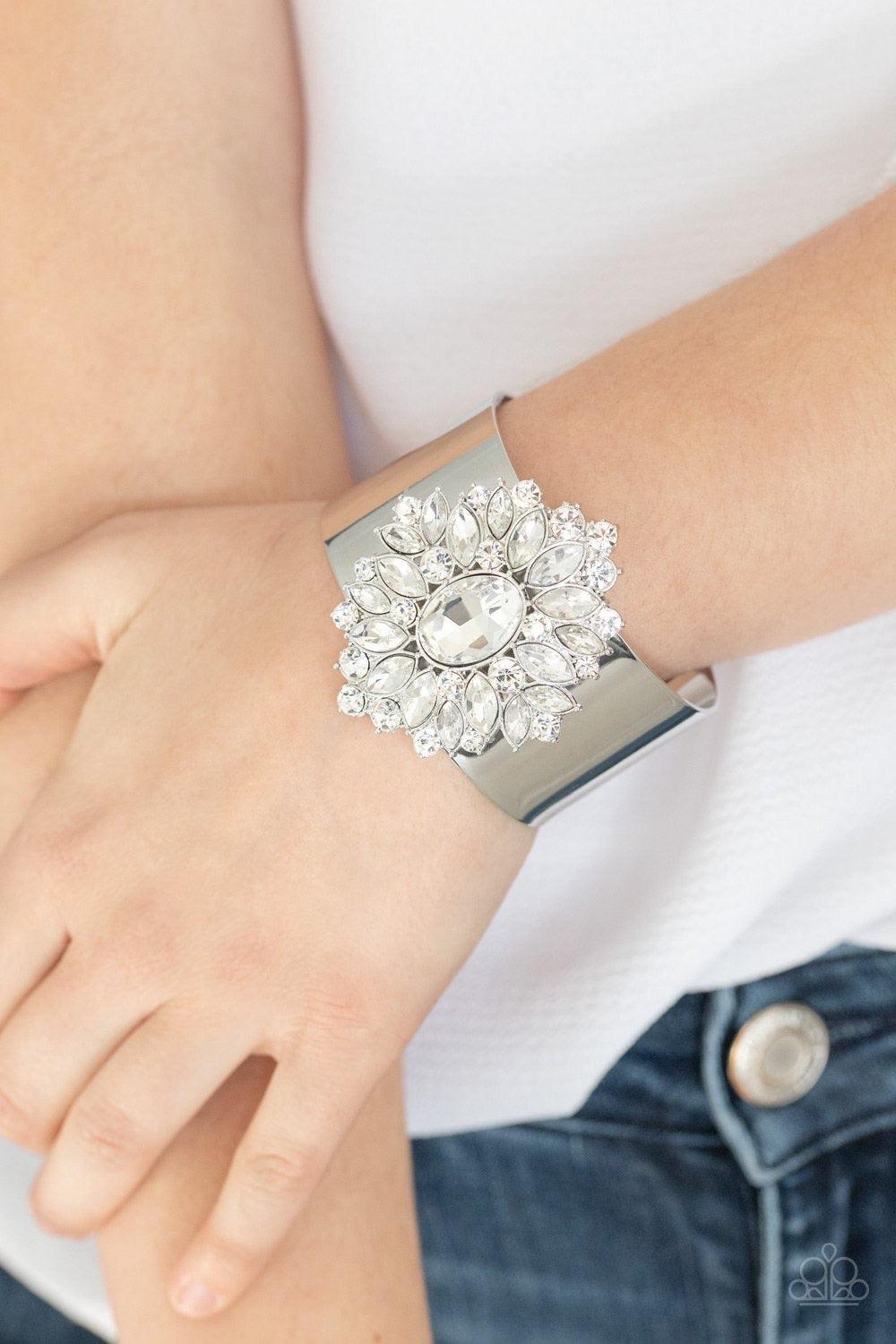 Paparazzi Accessories The Fashionmonger - White Featuring round and marquise style cuts, an explosion of sparkling white rhinestones flare from an oval gem, creating a glamorous floral pendant atop a thick silver cuff. Jewelry