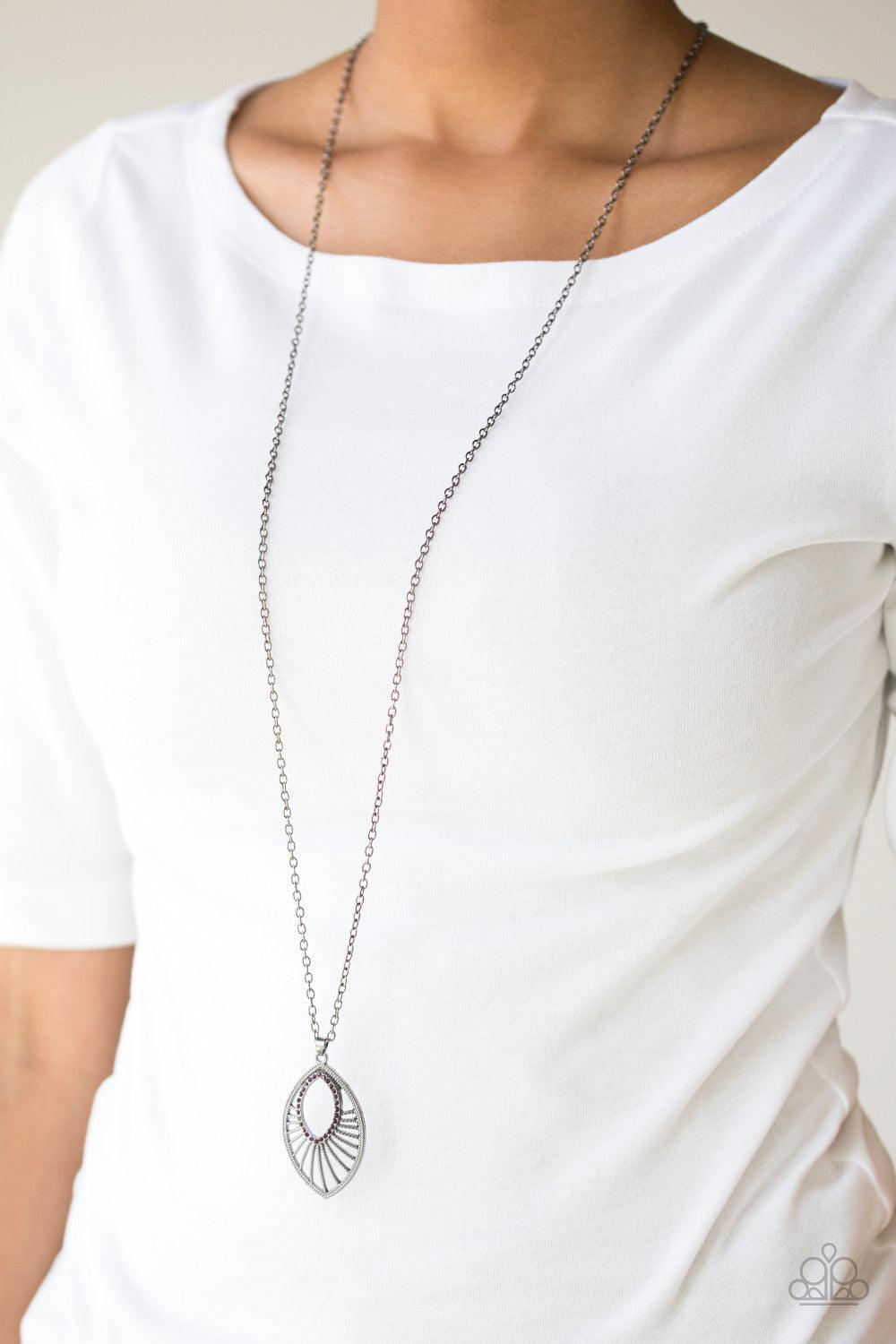 Paparazzi Accessories Court Couture - Purple Radiating with studded gunmetal bars, a glistening marquise shaped frame swings from the bottom of an elongated gunmetal chain. Glittery purple rhinestones adorn the frame, adding a refined flair to the regal p