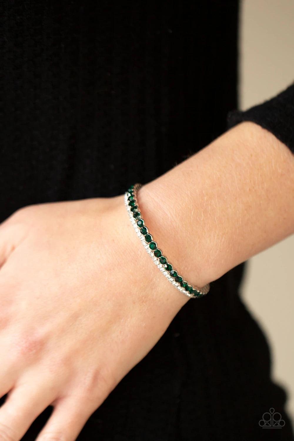 Paparazzi Accessories Fairytale Sparkle - Green Mismatched strands of glassy white and glittery green rhinestones stack into a dainty cuff around the wrist, creating a sparkly centerpiece. Sold as one individual bracelet. Bracelets
