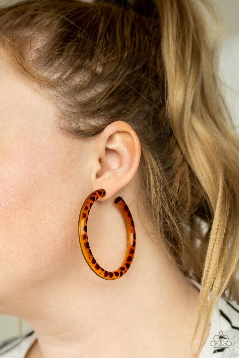 Paparazzi Accessories Miami Minimalist - Brown Dotted in a brown finish, an acrylic hoop curls around the ear for a retro look. Earring attaches to a standard post fitting. Hoop measures 2 1/2" in diameter. Jewelry