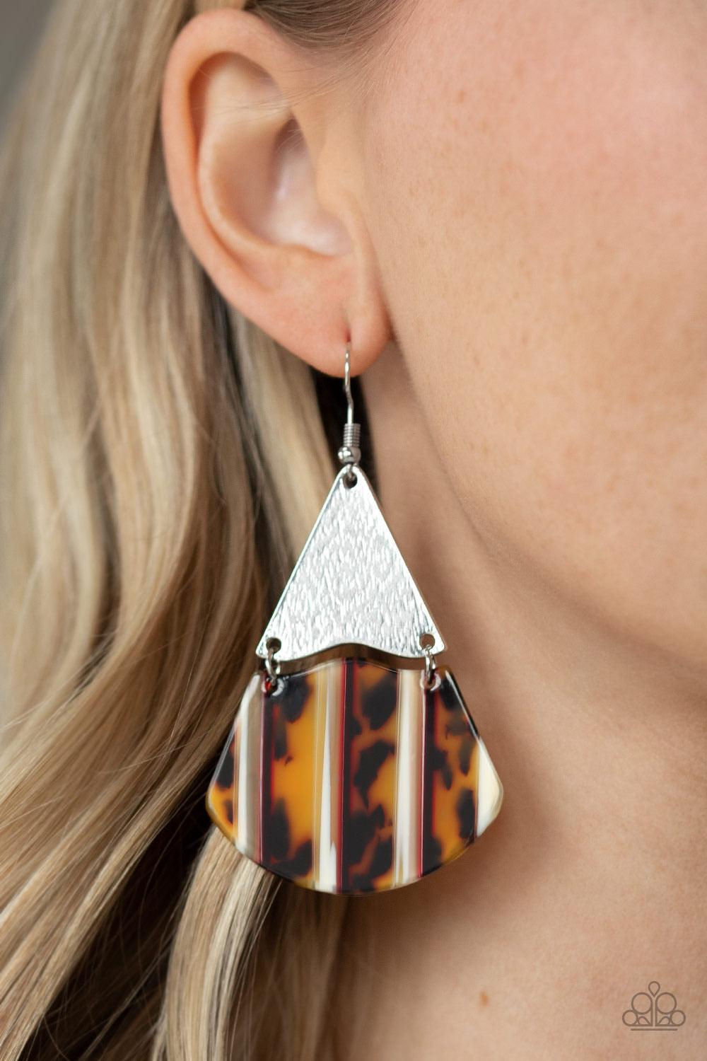 Paparazzi Accessories Social Animal - Yellow Streaked in sections of brown and yellow tortoise shell and red and white stripes, a wavy acrylic frame links to the bottom of a delicately hammered silver triangular plate, creating a wild lure. Earring attach
