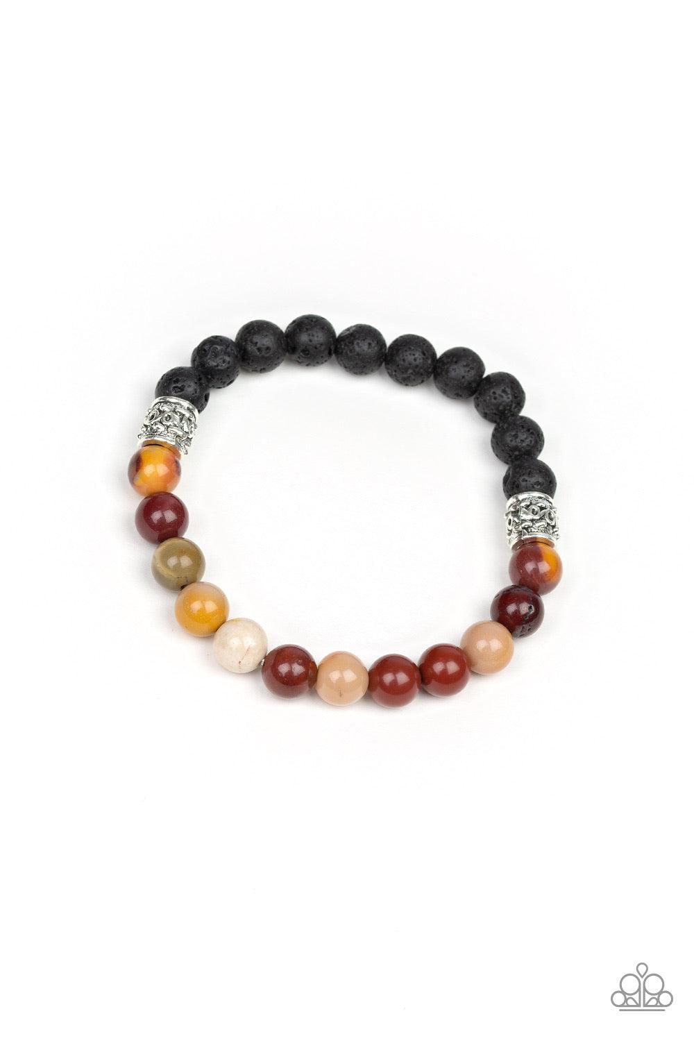 Paparazzi Accessories Take it Easy - Yellow Infused with dainty silver accents, a collection of black lava rock beads and refreshing stone beads are threaded along a stretchy band around the wrist for a seasonal style. Jewelry