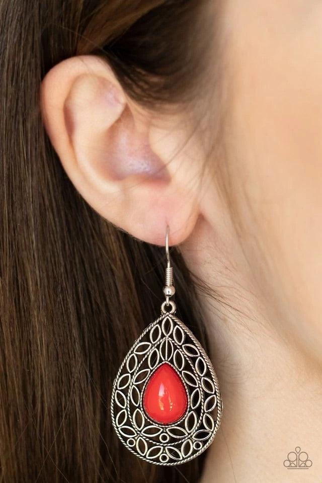 Paparazzi Accessories Fanciful Droplets - Red Fanciful teardrop frames filled with a charming leaf motif filigree envelop a bright red teardrop bead creating a captivating lure. Earring attaches to a standard fishhook fitting. Jewelry