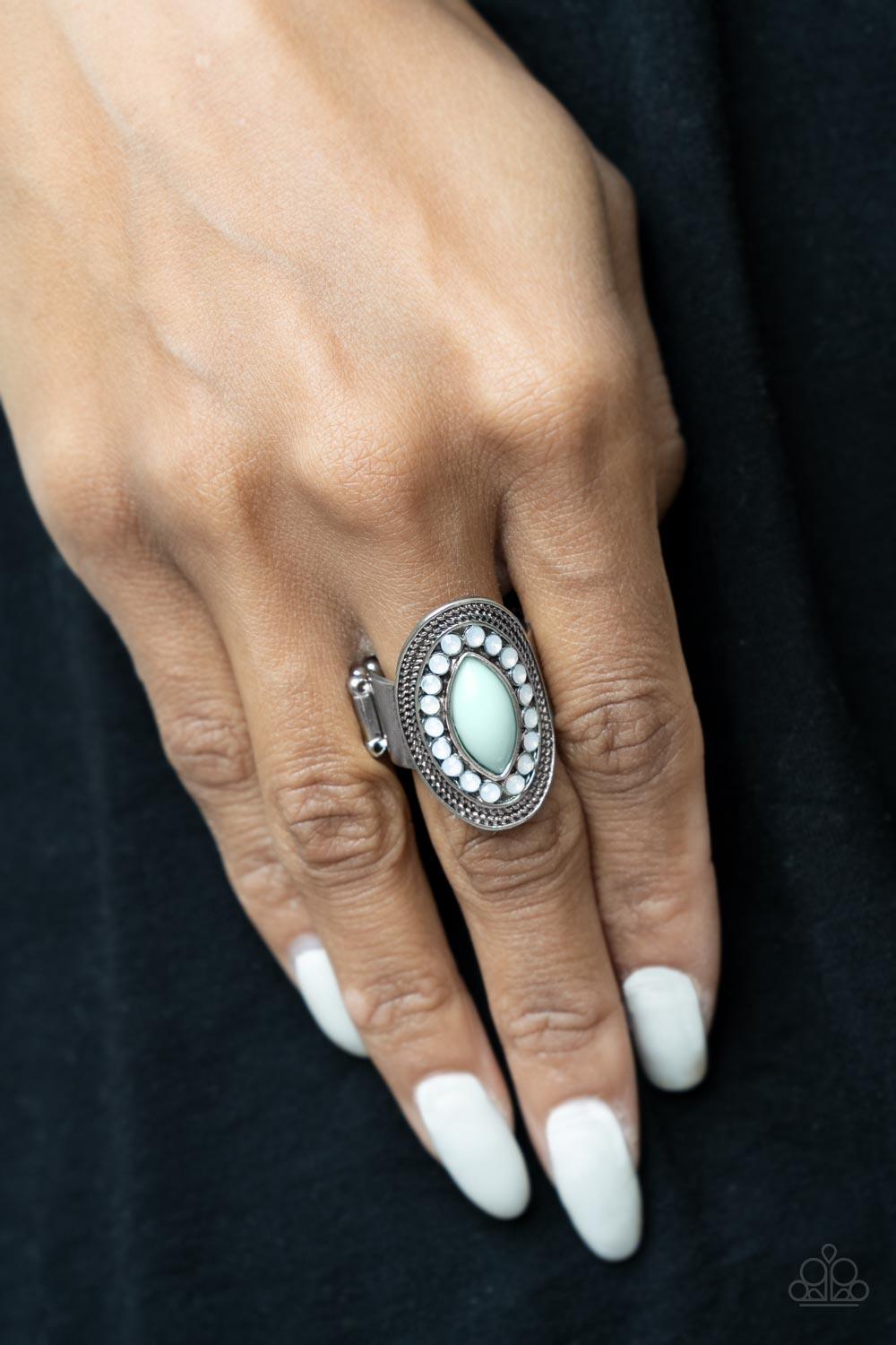 Paparazzi Accessories Tea Light Twinkle - Blue A silver frame embellished with dewy white beads and studded silver texture creates a stunning backdrop for a New Blue marquise cut bead as it sits atop the finger. Features a stretchy band for a flexible fit