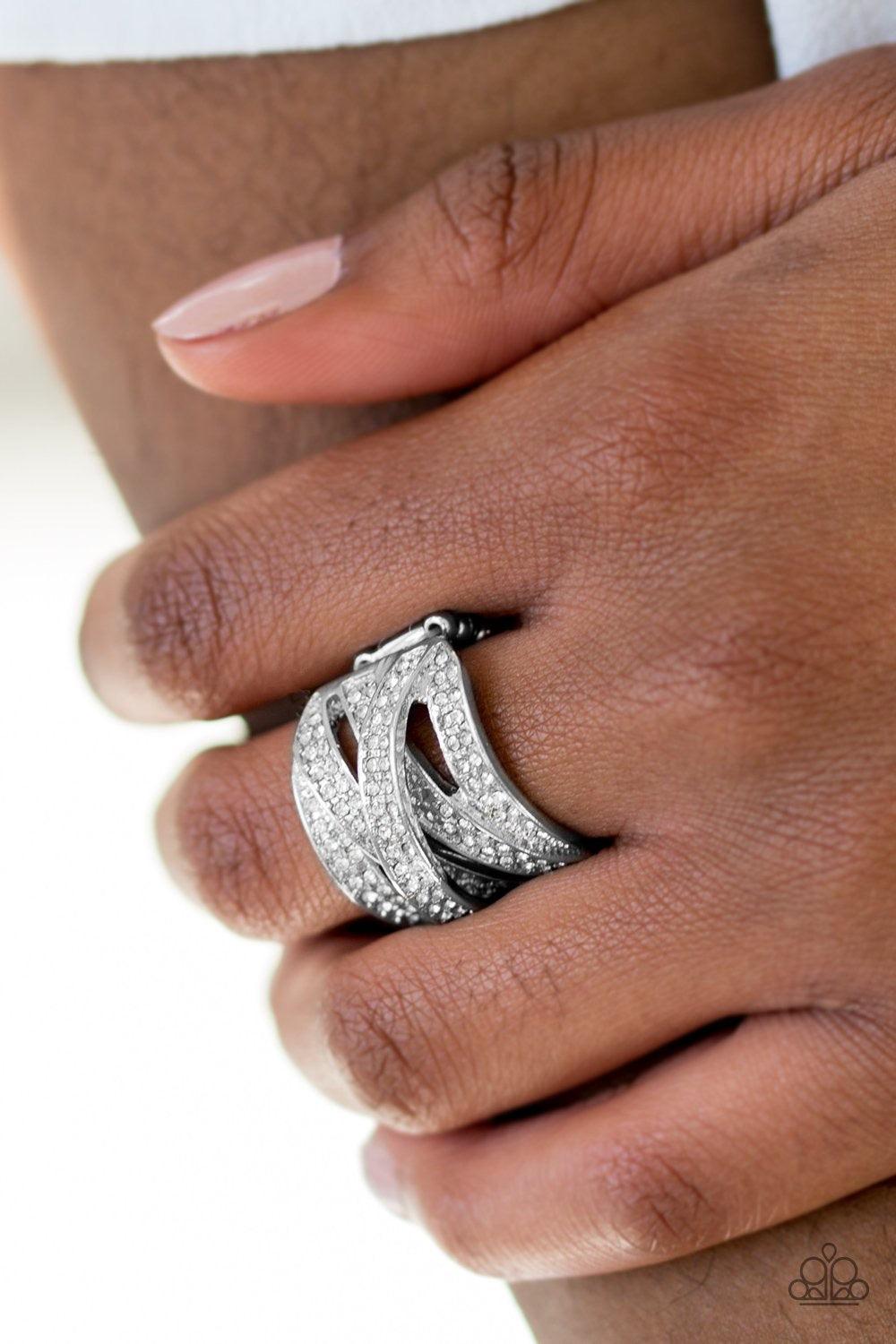Paparazzi Accessories Life In The Glitter - White Encrusted in rows of glittery white rhinestones, shimmery silver ribbons crisscross across the finger, creating a blinding centerpiece. Features a stretchy band for a flexible fit. Jewelry
