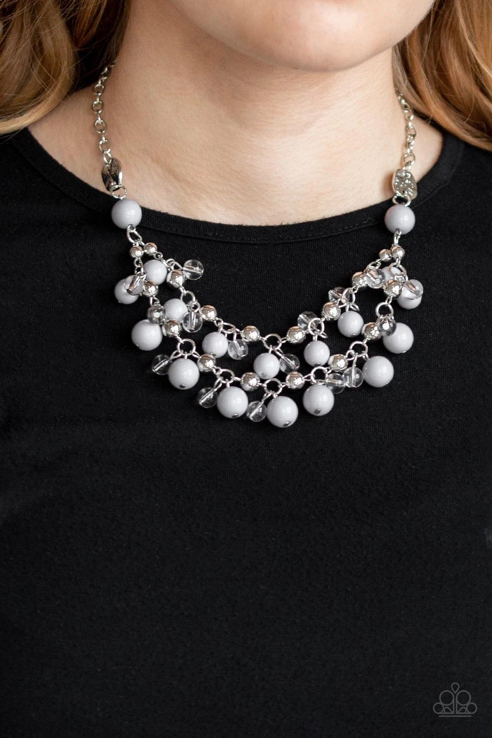 Paparazzi Accessories Seaside Soirée - White Hammered silver discs give way to layers of polished gray, glassy, and shiny silver beads. The colorful collection layers below the collar, creating a bubbly fringe. Features an adjustable clasp closure. Sold a