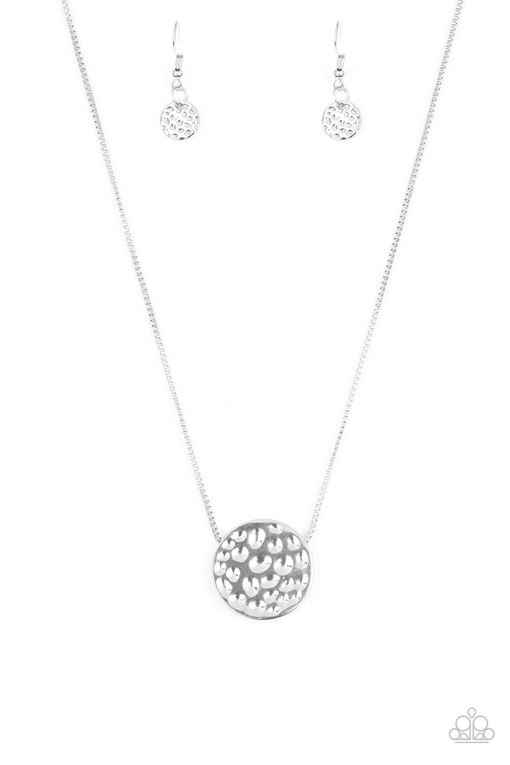 Paparazzi Accessories The BOLD Standard - Silver Delicately hammered in shimmery detail, a glistening silver pendant slides along a dainty silver box-chain below the collar for a bold look. Features an adjustable clasp closure. Sold as one individual neck