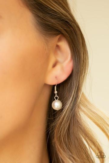 Paparazzi Accessories Pearl Prodigy - White Infused with dainty white pearls, a bubbly collection of over sized pearls link across the chest for a timeless finish. Features an adjustable clasp closure. Jewelry