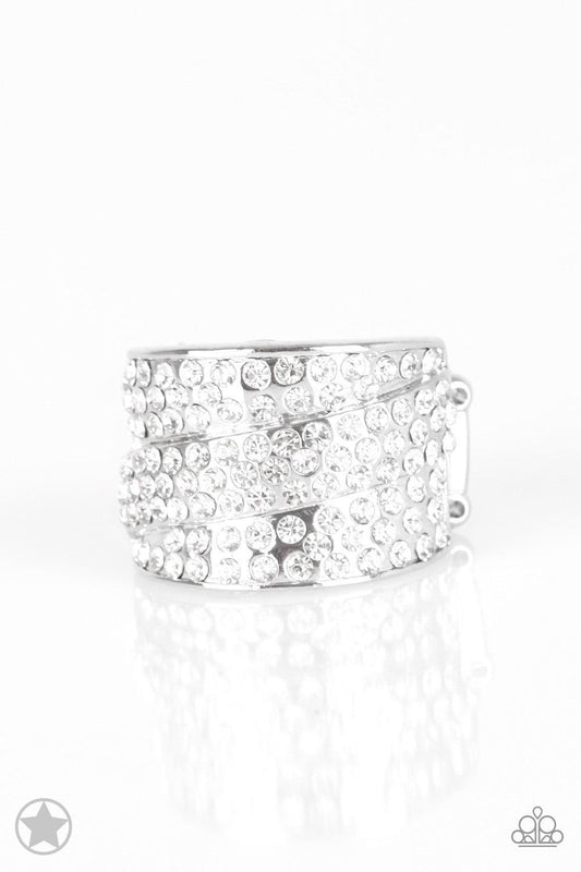 Paparazzi Accessories The Millionaires Club - White Row upon row of glistening white rhinestones stack into an incandescent display. An additional row of sparkling rhinestones wraps diagonally across the band for an extra splash of refined shimmer. Featur