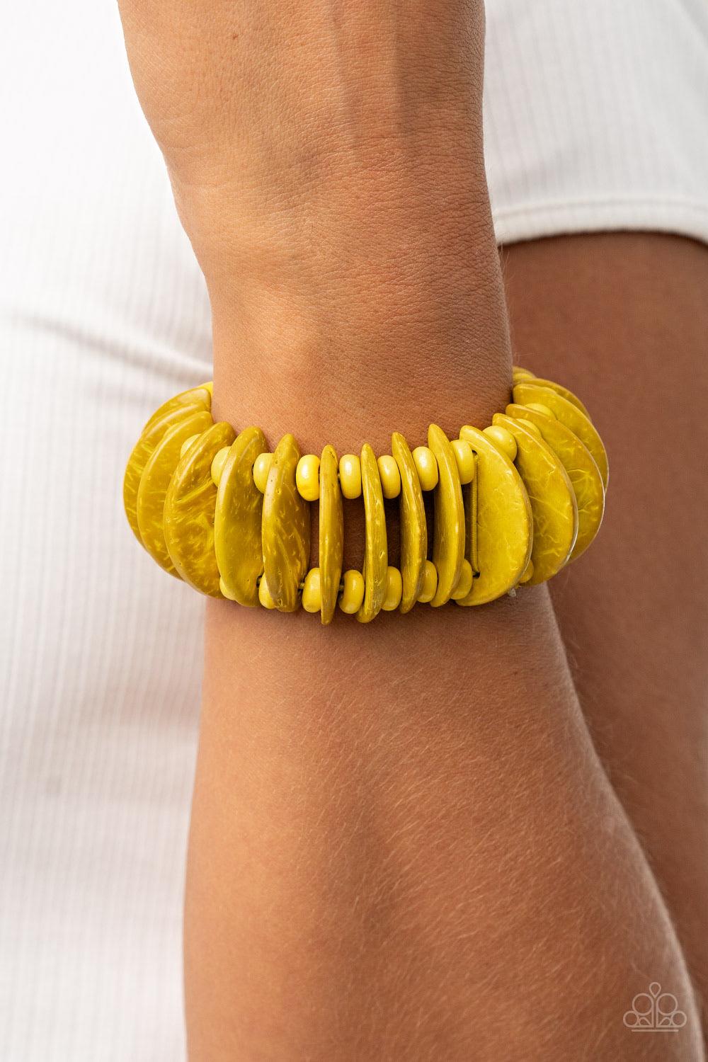 Paparazzi Accessories Tropical Tiki Bar - Yellow Infused with yellow wooden beads, distressed yellow wooden crescents are threaded along stretchy bands around the wrist for a summery look. Sold as one individual bracelet. Jewelry