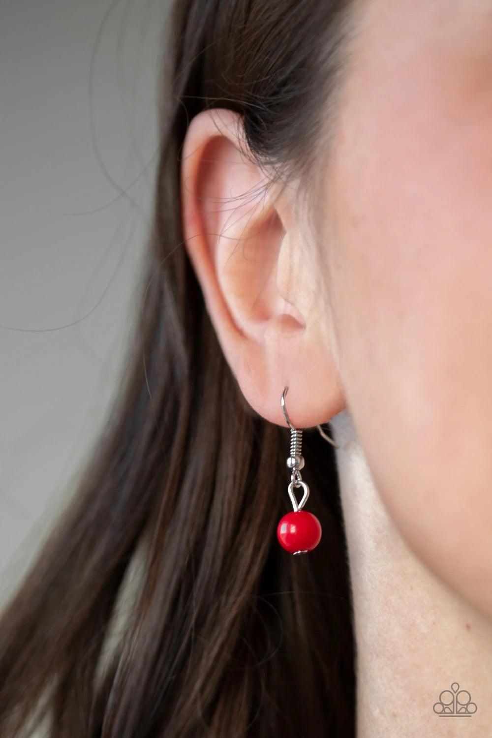 Paparazzi Accessories Color Boost - Red Featuring glassy and polished finishes, dainty red beads join ornate silver frames along a shimmery silver chain for a whimsical look. Features an adjustable clasp closure. Sold as one individual necklace. Includes
