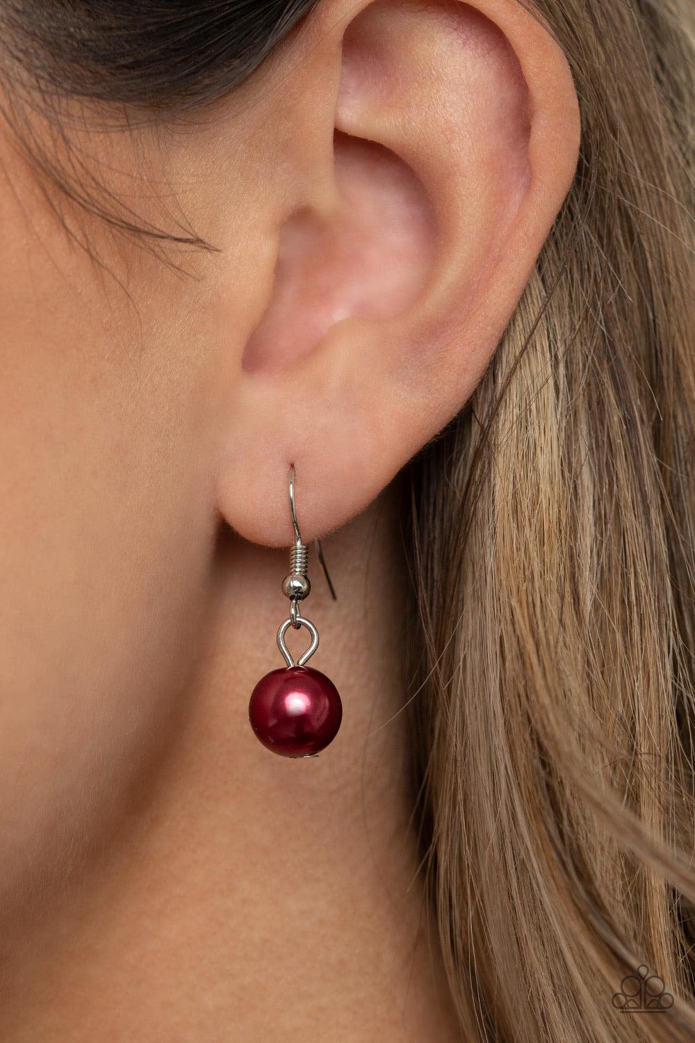 Paparazzi Accessories Prim And POLISHED - Red Threaded along an invisible wire, a pearly strand of red beads gives way to a section of chunky silver chain below the collar. Clusters of pearly red beads and smoky metallic-flecked crystals swing from the ch