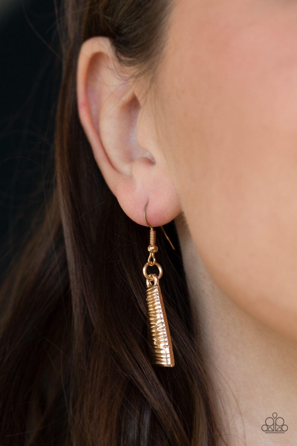 Paparazzi Accessories Feast Or Famine - Gold Etched in linear patterns, dramatic gold plates connect below the collar, joining into a fierce crescent-shaped pendant for a statement making look. Features an adjustable clasp closure. Jewelry