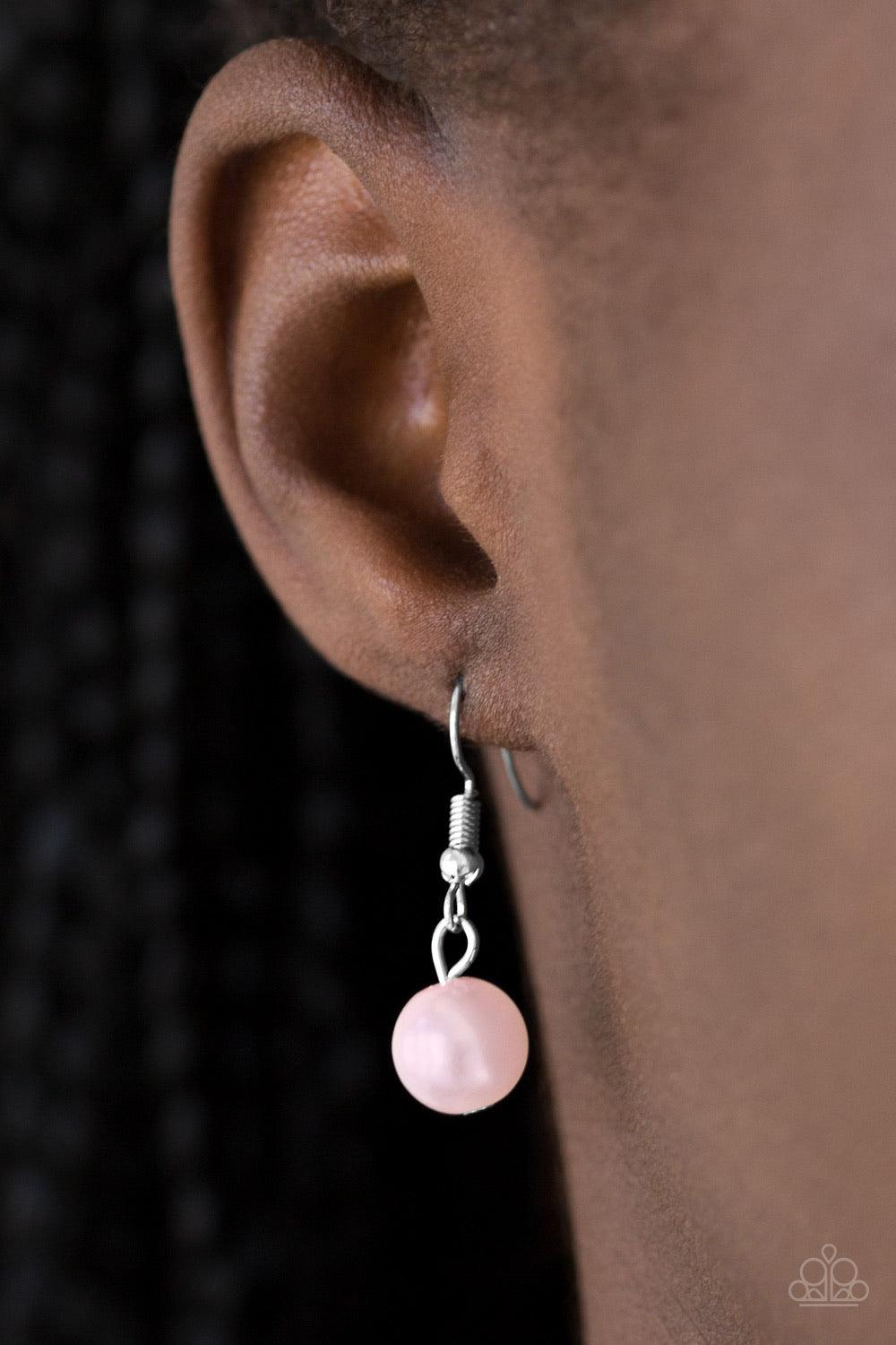 Paparazzi Accessories Hoppin Hearts - Pink Three rows of mismatched silver chains layer below the collar. Infused with airy heart cut-out centers, delicately hammered silver discs and pearly pink beads swing from the bottom of the lowermost chain, creatin